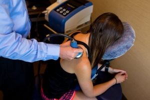 doctor using his equipment for therapy